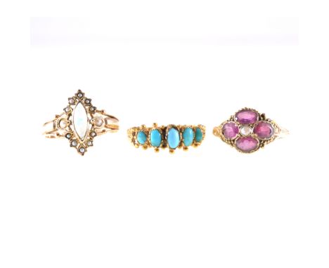 Three Edwardian dress rings, a marquise cabochon cut opal surrounded by seed pearls in an all yellow metal mount, reeded shan