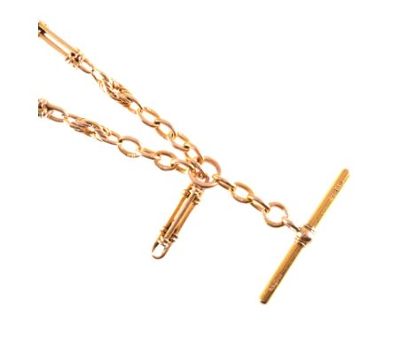 A yellow metal double albert watch chain, 20mm long double bar links spaced by twisted figure of eight links, fitted with a T