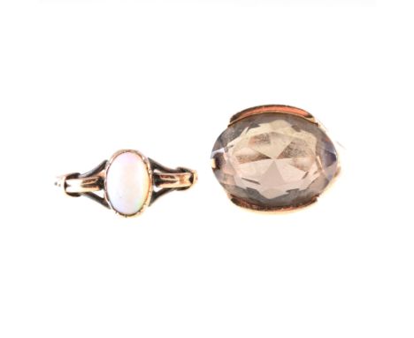 Two gemset dress rings, an oval cabochon cut opal, claw set in a rose metal mount mount, shank stamped 9ct, ring size O, an o