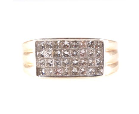 A diamond four row half hoop ring, thirty-two princess cut stones pave set in four rows to a 9 carat yellow and white gold mo