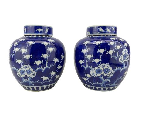 Pair of 20th century Chinese Prunus pattern ginger jars with flat covers, Kangxi six-character mark beneath, H20.5cm (2)
