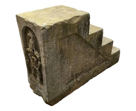 Late 19th century limestone four-step horse mounting block, with hewn sunken panelled sides, the back carved with the Wombwel