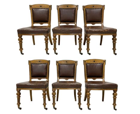 Set of six late Victorian Aesthetic Movement pollard oak and ebonised dining chairs, chamfered frames decorated with carved r