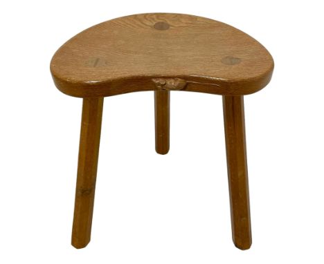 Mouseman - oak three-legged stool, dished kidney-shaped seat on three octagonal splayed supports, carved with mouse signature