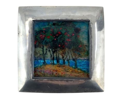 Early 20th century Liberty & Co. pewter box, the hinged cover inset with an enamel panel with trees, the sea beyond, in the m