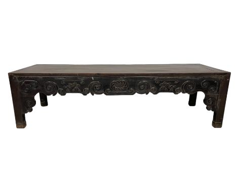 18th/19th Chinese hardwood low table of rectangular form, the frieze carved with a central crosshatched and gadrooned motif, 