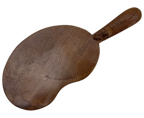Mouseman - adzed oak kidney-shaped cheeseboard, the handle carved with mouse signature, by the workshop of Robert Thompson, K