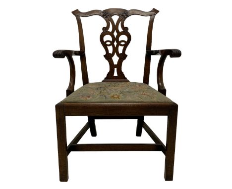 George III mahogany elbow chair, scroll eared cresting rail over carved shaped interlaced and pierced splat, swept arms with 