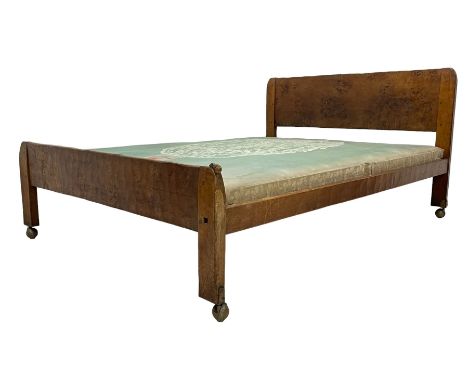Mouseman - 1930s figured burr oak 4' 6'' double bedstead, adzed boarded head and footboard with curved supports, on castors, 