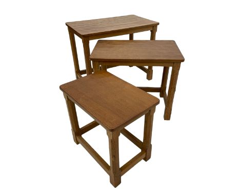 Mouseman - nest of three oak occasional tables, rectangular adzed top, on octagonal supports united by plain stretchers, each
