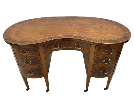 Edwardian mahogany and satinwood banded kidney-shaped writing desk, the shaped top with figured mahogany banding and boxwood 