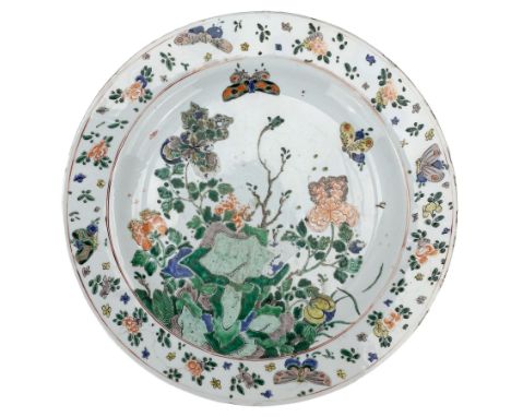 Chinese famille verte porcelain charger, Kangxi period, brightly enamelled with two butterflies in flight above chrysanthemum