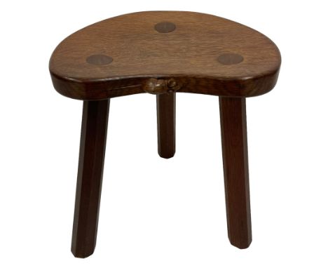 Mouseman - oak three-legged stool, dished kidney-shaped seat on three octagonal splayed supports, carved with mouse signature