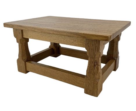Mouseman - oak footstool or low side table, rectangular adzed top on octagonal supports united by stretchers, carved with mou