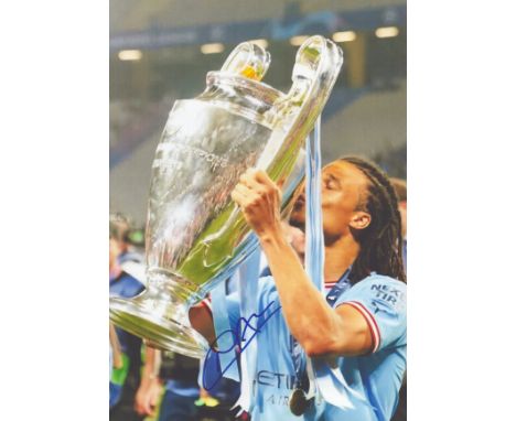 Nathan Ake signed 10x8inch colour photo pictured celebrating with the Champions League Trophy while with Manchester City. Goo