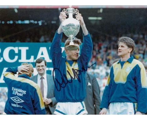 Autographed LEE CHAPMAN 8 x 6 photo : Col, depicting Leeds United striker LEE CHAPMAN holding aloft the First Division trophy