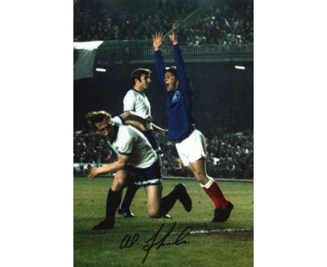 Autographed WILLIE JOHNSTON 12 x 8 photo : Col, depicting a superb image showing Rangers striker WILLIE JOHNSTON jumping with