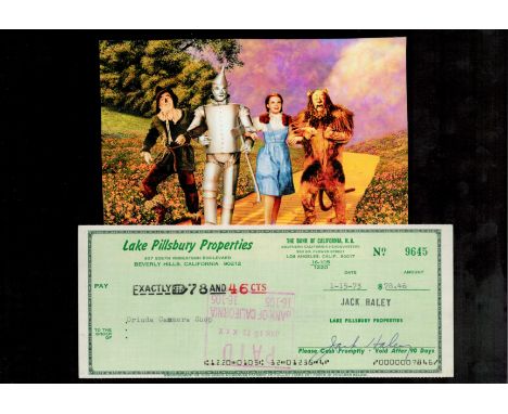 Jack Haley signed cheque with unsigned colour photo from Wizard of Oz. Good condition. All autographs come with a Certificate