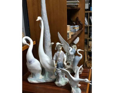 A Lot of Lladro &amp; Nao figures, Includes large lladro swan table lamp, Lladro swan taking off, Lladro fisherman &amp; Nao 