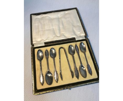 A Set of 6 Solid Sheffield silver tea spoons and sugar tongs, Fitted within an ornate case. Makers William Briggs &amp; Co. D