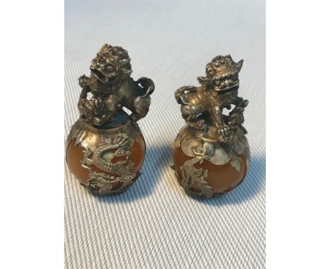 A Pair of Chinese white metal and jade/hard stone foo dog statues. Measure 6cm in height 