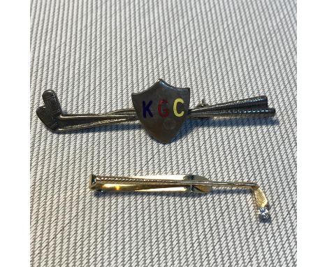 A 14k Anson golf club shaped tie clip styled with a single diamond as a golf ball. Weighs 2.37grams. Together with Dublin sil