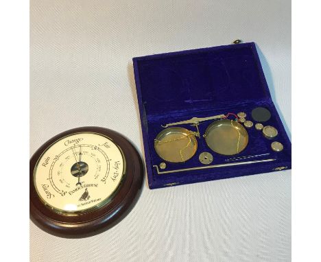 A Famous grouse advertising barometer together with a boxed set of weighing scales with weights. 