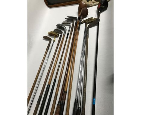 A Collection of Hickory shafted gold clubs also includes vintage clubs. Includes two John Letters putters, Two Hickory shaft 