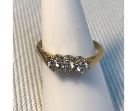 A Ladies 18ct gold and .42ct diamond stone ring, (One .18ct stone &amp; two .12ct stones) Consists of three round cut diamond