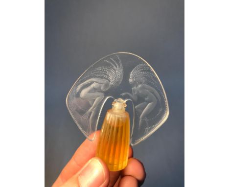 A Vintage Lalique perfume bottle showing two nude art nouveau lady figures, Measures 7.3cm in height 
