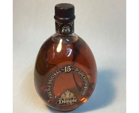 The original Dimple 15 years old Fine old Original De Luxe Scotch Whisky. 1 Litre bottling. Full and sealed 