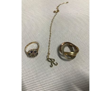 A 9ct gold three tone brooch together with a 9ct gold K Pendant and chain. The lot also includes A 9ct gold scrap ring. Total