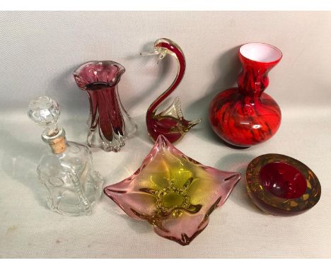 A selection of various collectable art glass, mainly of a red theme together with a glass decanter 