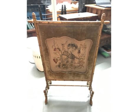 Antique tapestry detailing an art nouveau lady portrait firescreen, carved supports shaped like bamboo trunks. 