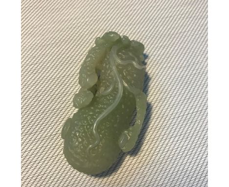 Antique Chinese hand carved jade sculpture of a piece of fruit. Measures 6.3cm in length