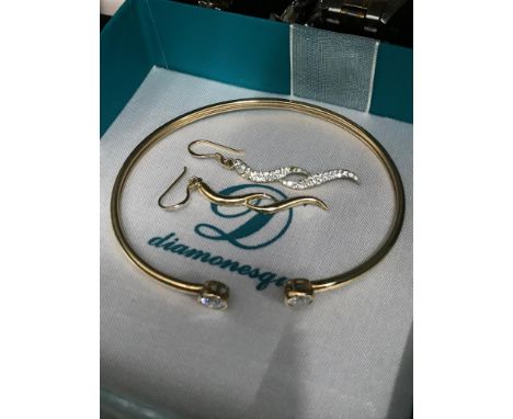 A 9ct gold ladies bangle together with a pair of 9ct gold twist earrings. Total weight 6.17grams 