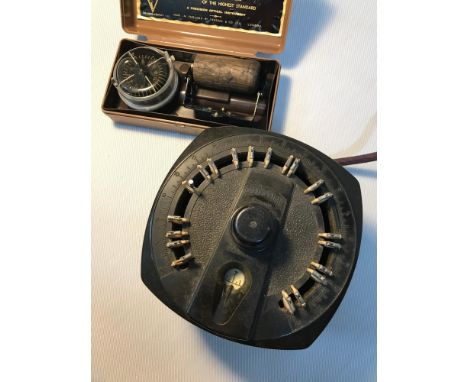A Vintage Mercury time switch together with vintage military style compass. 