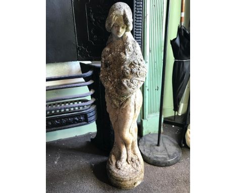 Vintage garden ornament of a nude lady holding a bouquet of flowers figure. Measures 78cm in height 