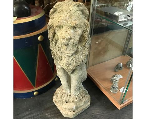A Vintage garden lion ornament. measures 55cm in height 