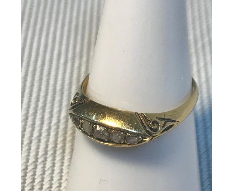A Birmingham 18ct gold ladies ring set with 5 diamonds, Ring size M, Weighs 2.80grams 
