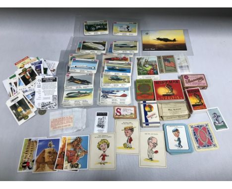 A Collection of vintage cigarette boxes, cards, playing cards and whisky cards 