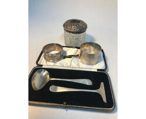 A Birmingham silver topped dressing table jar, Two various sized Birmingham silver napkin rings &amp; Sheffield silver cased 