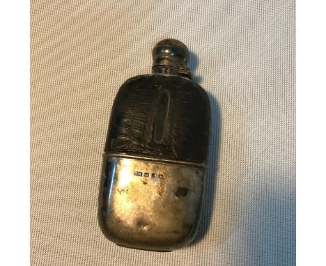 A Birmingham silver, glass and leather hip flask. Maker Thomas Hayes and dated 1895. 