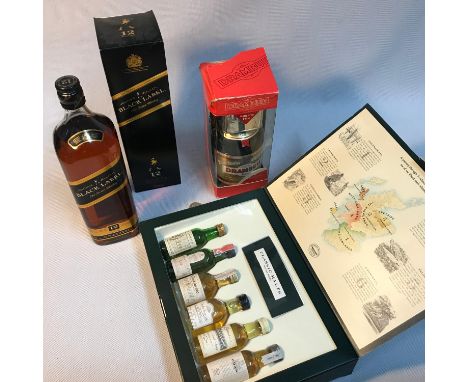 Johnnie Walker Black Labelold Scotch Whisky 12 years old, full, sealed and boxed. A Bottle of Drambuie full, sealed and boxed