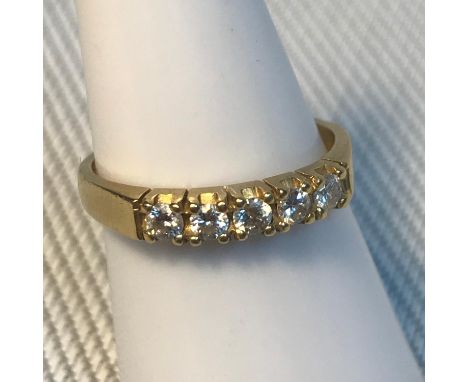 A Ladies 18ct gold and 0.15ct diamond stone ring, Consists of Five .03ct round cut diamonds. Very bright diamonds, Ring size 