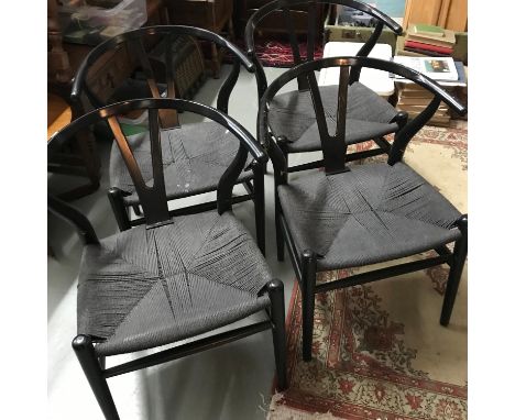 A Set of 4 retro curved back dining chairs, Weaved black thread bases. Light wood under black paint. 