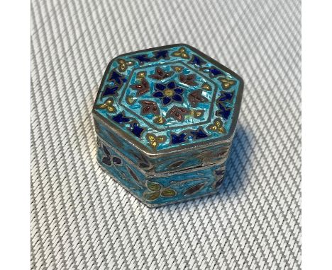 A Small silver 925 and enamel Hexagonal shaped pill box. Designed in an Indian manner. Measures 2.5cm in diameter 