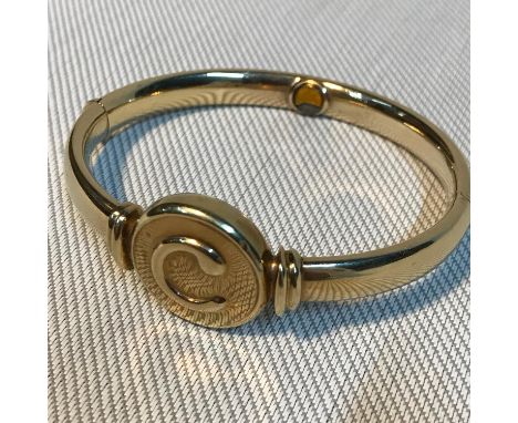 A Solid 9ct gold bangle fitted with a magnet (Magnotherapy bangle).Weighs 28.87grams 