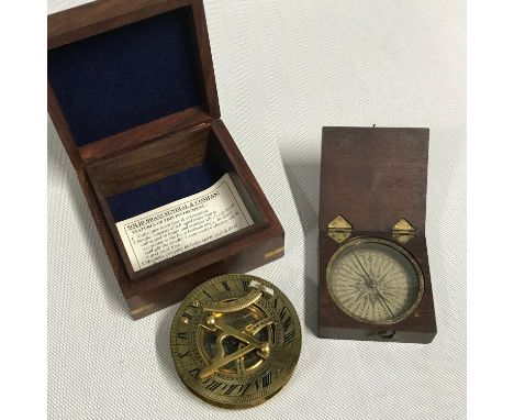 A Victorian mahogany cased pocket compass together with a replica brass sundial and compass with a hardwood and brass inlaid 