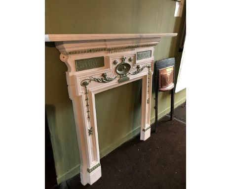 A Georgian cast iron fire surround fitted with a wooden mantel shelf. Measures 127x138cm 